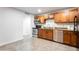 Clean updated kitchen boasts stainless steel appliances, granite countertops, and tile floors at 8021 W Hazelwood St, Phoenix, AZ 85033