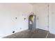 A utility room featuring a new water heater, a door to the garage, and updated electric at 8021 W Hazelwood St, Phoenix, AZ 85033