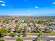 Picturesque aerial view of a neighborhood with lush landscaping, and tree-lined streets in a desirable area at 8318 E Via De Los Libros --, Scottsdale, AZ 85258