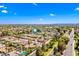 Neighborhood aerial view showcasing tree-lined streets, well-maintained homes, and convenient access to the main road at 8318 E Via De Los Libros --, Scottsdale, AZ 85258