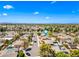 Expansive aerial view of the neighborhood showcasing lush landscaping and well-maintained homes under a clear blue sky at 8318 E Via De Los Libros --, Scottsdale, AZ 85258