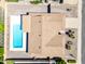 Aerial view of a home with a sparkling pool, desert landscaping, and a two-car carport at 8318 E Via De Los Libros --, Scottsdale, AZ 85258