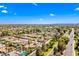 Neighborhood aerial view showcasing tree-lined streets, well-maintained homes, and convenient access to the main road at 8318 E Via De Los Libros --, Scottsdale, AZ 85258
