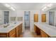 Spacious bathroom featuring double sinks, wood cabinetry, and bright vanity lighting at 8318 E Via De Los Libros --, Scottsdale, AZ 85258