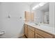 Bathroom vanity featuring a sink, storage and a large mirror and lighting at 8318 E Via De Los Libros --, Scottsdale, AZ 85258