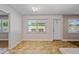 Bright dining area with tile flooring and large windows offering pleasant views, next to an entryway at 8318 E Via De Los Libros --, Scottsdale, AZ 85258