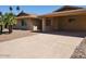 View of the home's exterior and driveway with a convenient covered carport at 8318 E Via De Los Libros --, Scottsdale, AZ 85258