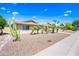 Lovely single-story home with desert landscaping, mature palm trees and cactus, and a two-car carport at 8318 E Via De Los Libros --, Scottsdale, AZ 85258