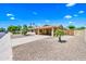 Beautiful single-story home with a two-car carport, desert landscaping, and a meticulously kept front yard at 8318 E Via De Los Libros --, Scottsdale, AZ 85258
