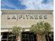 Exterior shot of LA Fitness with prominent signage and landscaped entry at 8318 E Via De Los Libros --, Scottsdale, AZ 85258