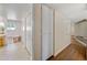 Hallway with white walls and wooden floors, leading to several rooms and providing ample closet space at 8318 E Via De Los Libros --, Scottsdale, AZ 85258