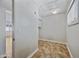 Bright laundry room featuring tile floor and convenient access to attic space and nearby rooms, offering practicality and seamless transitions at 8318 E Via De Los Libros --, Scottsdale, AZ 85258
