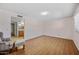Large room featuring light pink walls, hardwood floors, a chair and ottoman, and lots of natural light at 8318 E Via De Los Libros --, Scottsdale, AZ 85258