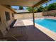Covered patio featuring an in-ground pool, providing a relaxing outdoor living space at 8318 E Via De Los Libros --, Scottsdale, AZ 85258