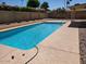 Inviting in-ground pool surrounded by a well-kept patio and privacy wall at 8318 E Via De Los Libros --, Scottsdale, AZ 85258