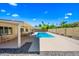 Backyard oasis with a swimming pool, patio seating, and beautiful landscaping, ideal for serene outdoor enjoyment at 8318 E Via De Los Libros --, Scottsdale, AZ 85258