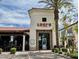Charming exterior view of Luci's at the Grove, featuring outdoor seating and lush landscaping at 8318 E Via De Los Libros --, Scottsdale, AZ 85258