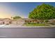 Attractive single-Gathering home featuring a three-car garage and mature landscaping at 8748 W Maui Ln, Peoria, AZ 85381