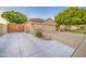 Charming single-Gathering home showcasing a three-car garage, long driveway, and mature landscaping at 8748 W Maui Ln, Peoria, AZ 85381