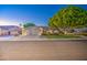 Charming single-Gathering home showcasing a manicured lawn and an attached three-car garage at 8748 W Maui Ln, Peoria, AZ 85381