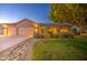 Well-maintained single-Gathering home showcasing landscaped yard and an attached three-car garage at 8748 W Maui Ln, Peoria, AZ 85381
