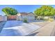 Well-maintained home with a three-car garage and a spacious driveway with gate at 8748 W Maui Ln, Peoria, AZ 85381