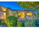 Beautiful single-Gathering home showcasing a landscaped yard and an attached two-car garage at 8748 W Maui Ln, Peoria, AZ 85381