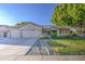 Lovely home with well-manicured landscaping, a three-car garage and charming curb appeal at 8748 W Maui Ln, Peoria, AZ 85381