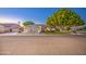 Charming single-Gathering home showcasing a manicured lawn and an attached three-car garage at 8748 W Maui Ln, Peoria, AZ 85381