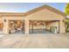 Spacious three-car garage with organized storage and work areas, perfect for projects and parking at 8748 W Maui Ln, Peoria, AZ 85381