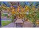 Outdoor dining area featuring a wooden table, seating, and string lights at 8748 W Maui Ln, Peoria, AZ 85381
