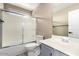 Bathroom featuring shower and bathtub combination, a toilet, and a vanity at 8795 W Windsor Dr, Peoria, AZ 85381