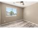 Well-lit bedroom with natural light from the window overlooking the neighborhood at 8795 W Windsor Dr, Peoria, AZ 85381