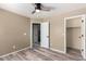 Bedroom with wood-look floors and two doors leading to other rooms at 8795 W Windsor Dr, Peoria, AZ 85381