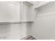 Walk-in closet featuring white shelving and metal hanging bars at 8795 W Windsor Dr, Peoria, AZ 85381