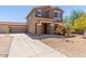 Attractive two-story home with a low-maintenance yard, long driveway, and a convenient three-car garage at 8795 W Windsor Dr, Peoria, AZ 85381