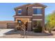 Charming front exterior of a two-story home with a well-maintained yard, lovely curb appeal, and a welcoming entrance at 8795 W Windsor Dr, Peoria, AZ 85381