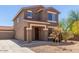 Attractive two-story home with a low-maintenance yard, long driveway, and a convenient three-car garage at 8795 W Windsor Dr, Peoria, AZ 85381