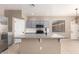 Charming kitchen with blue cabinets, stainless steel appliances, and a large center island at 8795 W Windsor Dr, Peoria, AZ 85381