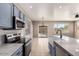 Modern kitchen with blue cabinets, stainless steel appliances, and sleek white countertops at 8795 W Windsor Dr, Peoria, AZ 85381