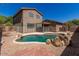 Swimming pool surrounded by gravel and brick with a view of the home at 8795 W Windsor Dr, Peoria, AZ 85381