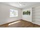 Bedroom features include wood-look flooring and natural light through a large window at 9330 E Kalil Dr, Scottsdale, AZ 85260