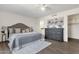 Main bedroom showcasing a decorative ceiling fan, wood-look flooring, and en-suite bathroom at 9330 E Kalil Dr, Scottsdale, AZ 85260
