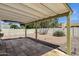 Covered patio featuring desert landscaping and a white block fence for added privacy and a built-in lighting system at 9330 E Kalil Dr, Scottsdale, AZ 85260