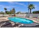Backyard pool surrounded by desert landscaping and block fence, enhancing the private, relaxed atmosphere at 9330 E Kalil Dr, Scottsdale, AZ 85260