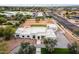 Aerial view of a modern home with beautiful landscaping and a large driveway at 9611 E Clinton St, Scottsdale, AZ 85260
