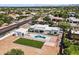 Panoramic aerial view of a modern home featuring a backyard pool, lush lawn, and an open layout for luxurious living at 9611 E Clinton St, Scottsdale, AZ 85260