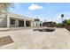 View of a large backyard with a pool, patio, and modern home exterior at 9611 E Clinton St, Scottsdale, AZ 85260