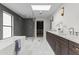 Bright bathroom featuring a freestanding tub, glass shower, and double sink vanity at 9611 E Clinton St, Scottsdale, AZ 85260