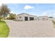 Long driveway leading to a large 3-car garage, perfect for car enthusiasts at 9611 E Clinton St, Scottsdale, AZ 85260